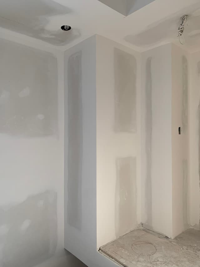 a room that is being remodeled with white paint