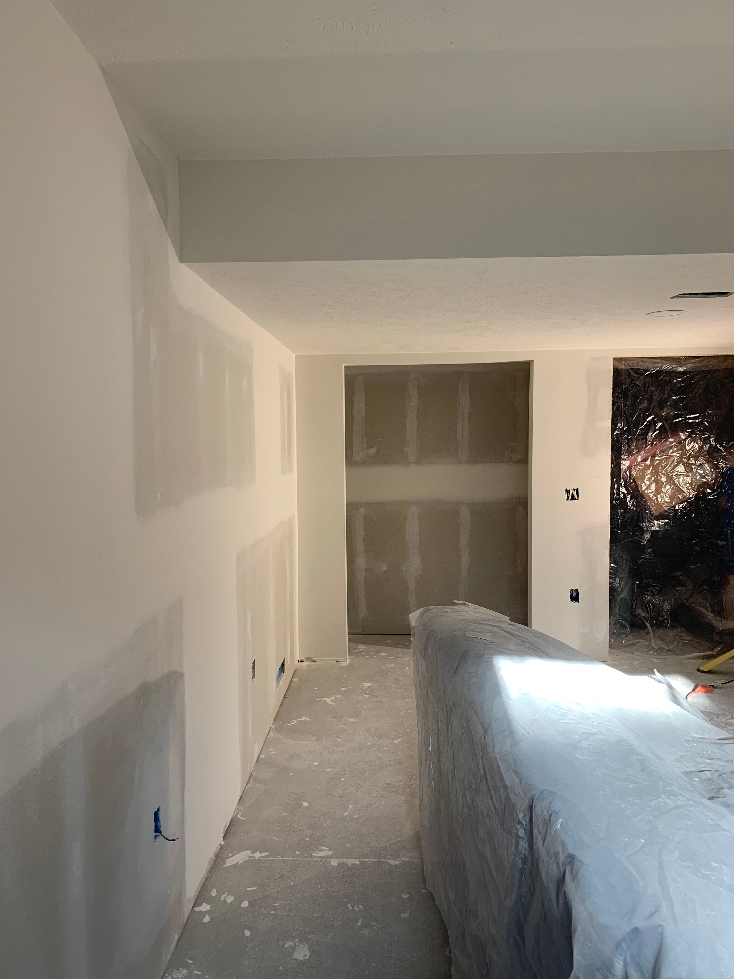 a room that is being remodeled with white paint
